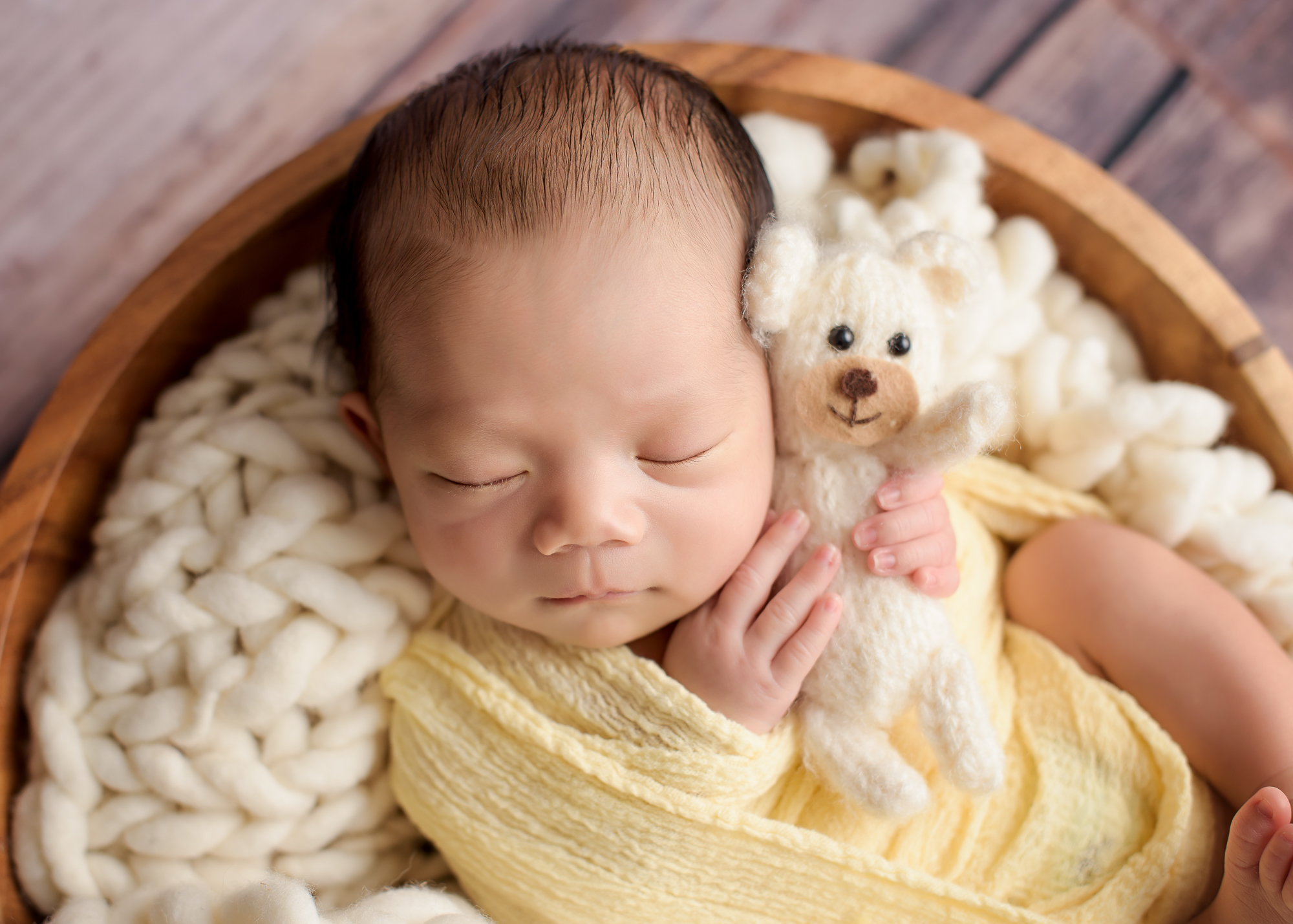 Calgary Newborn Photographer Baby Holding Teddy Bear