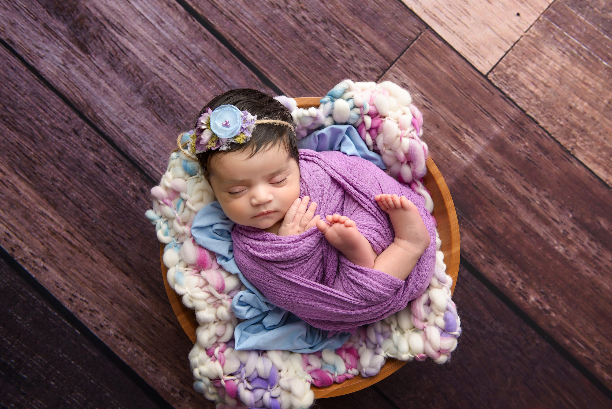 Calgary Newborn Photographer Purple On Wooden Floor