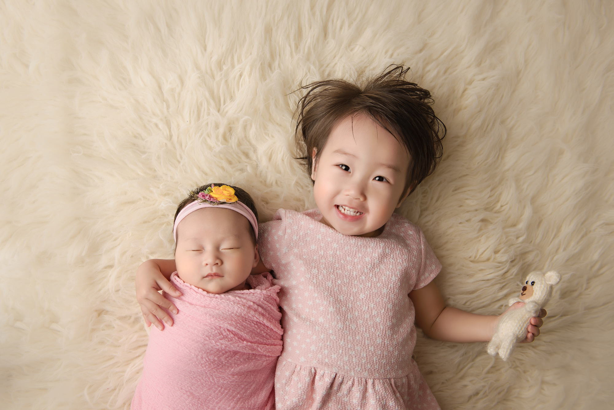 Calgary Newborn Photographer Baby Girl With Big Sister Pink And Cream