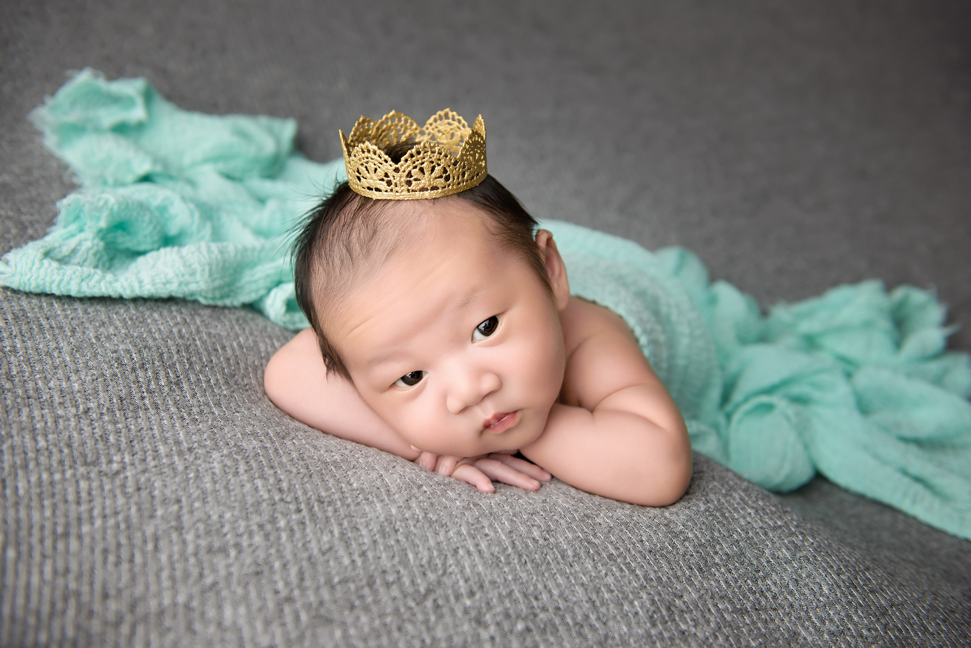 Newborn Baby Boy Wearing A Crown