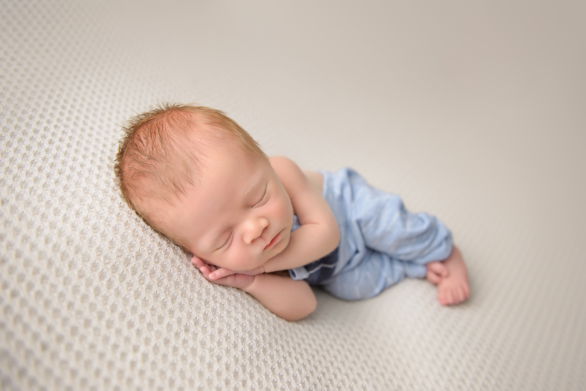 Newborn Photography Baby Sleeping On His Side