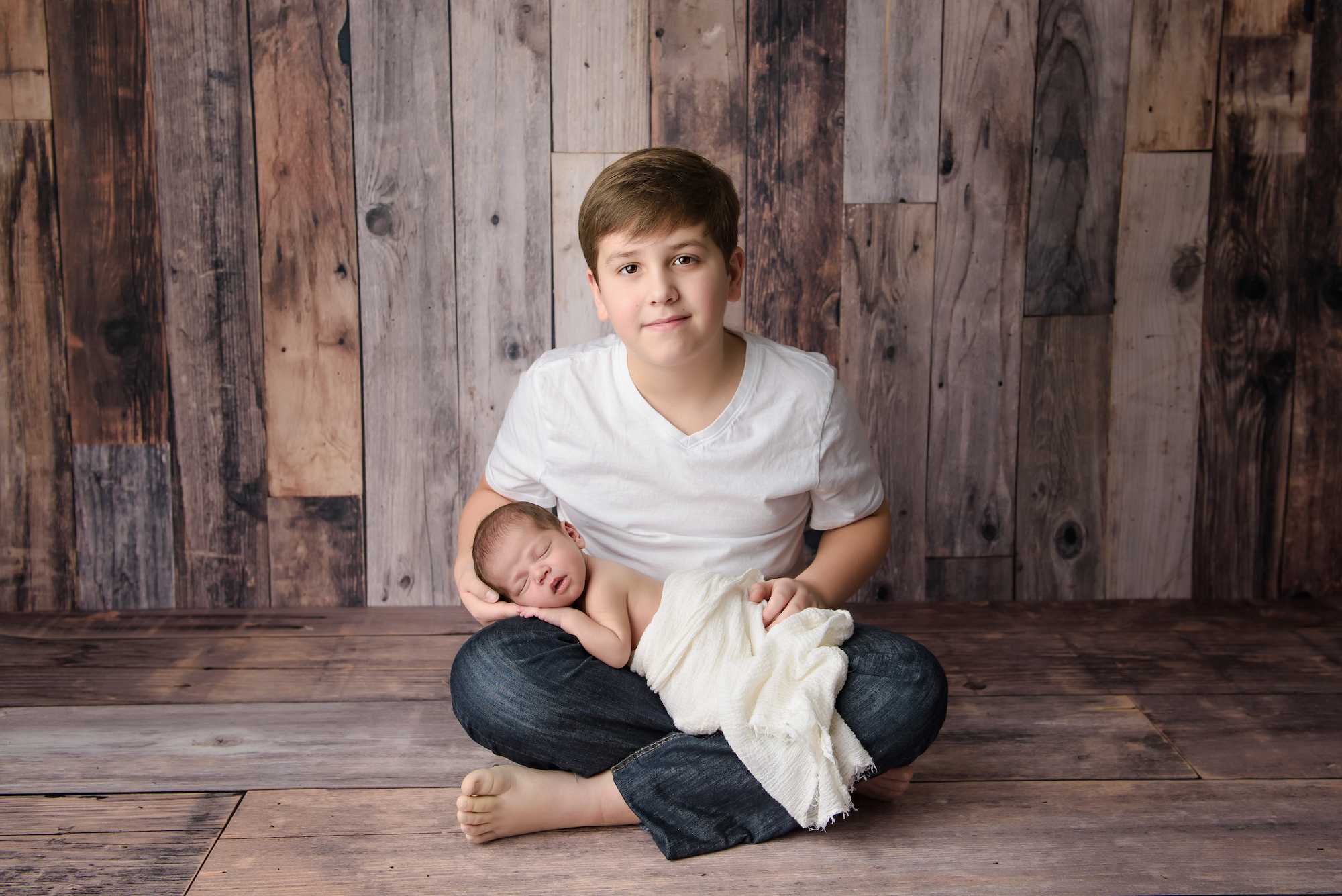 Calgary Newborn Photographer Big Brother Holding Baby
