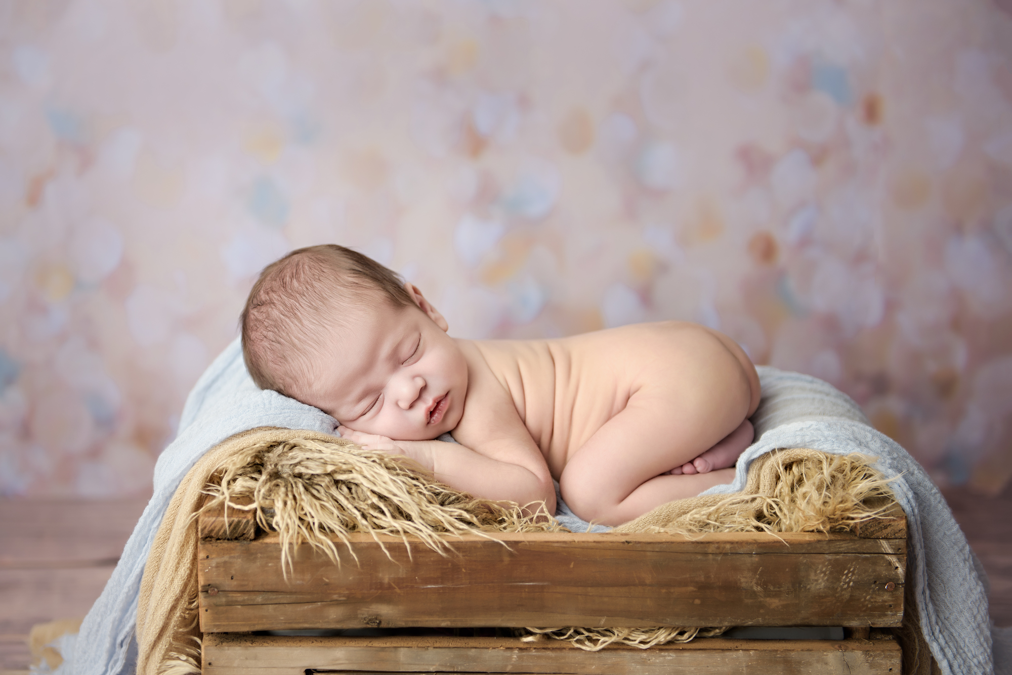 Calgary Newborn Photographer Naked Baby On Wooden Basket
