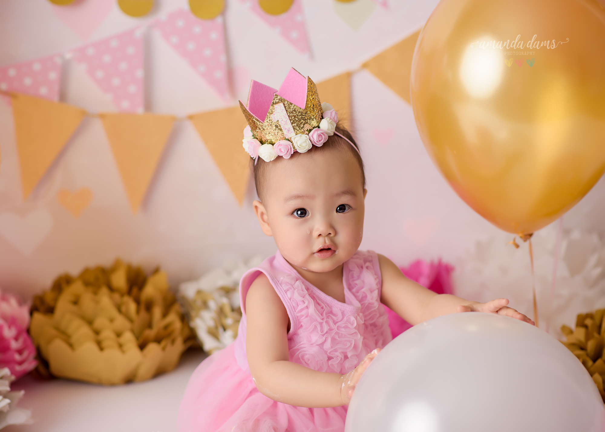 Amanda Dams Photography Pink And Gold Cake Smash Charlotte Playing With Balloons