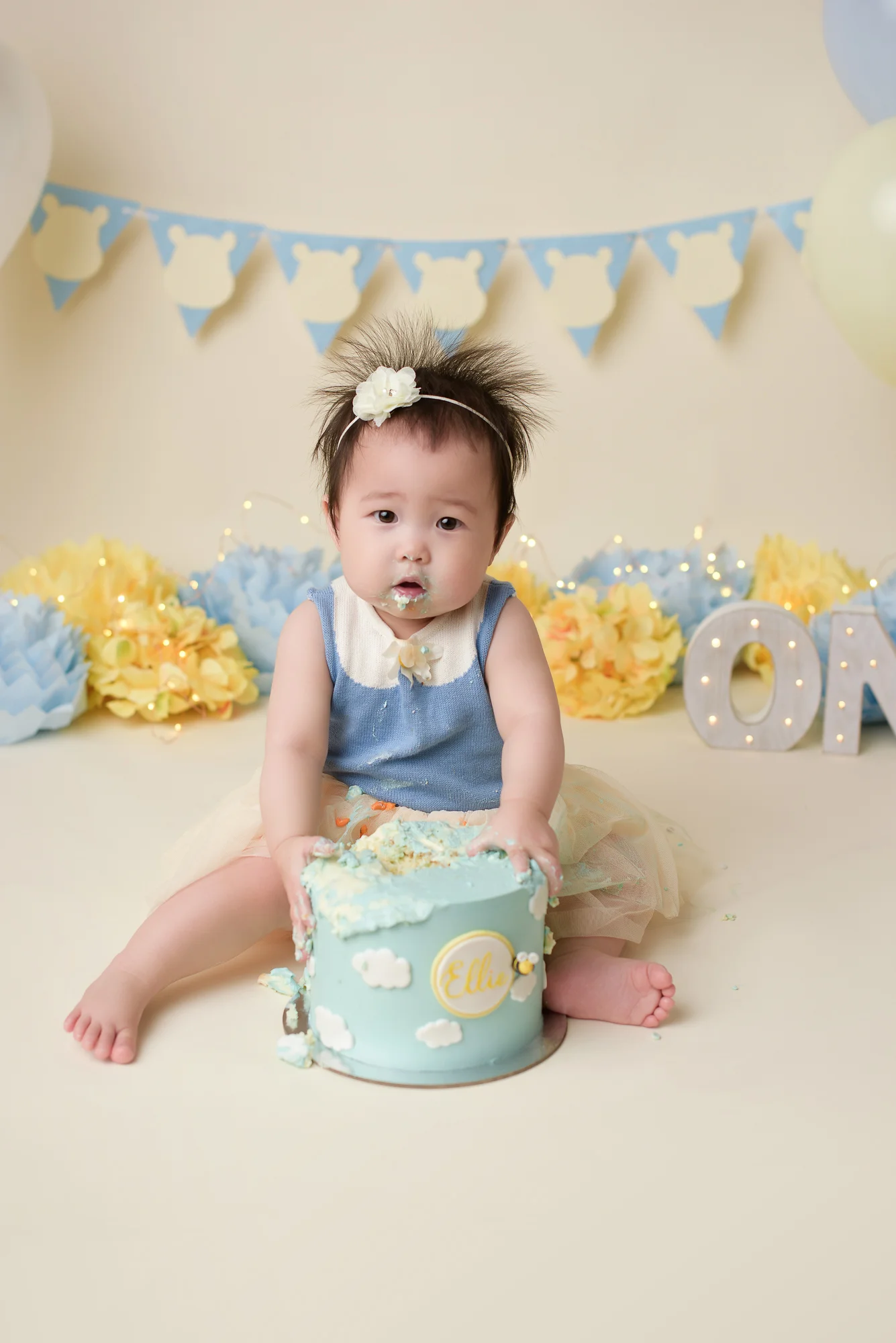 yellow and blue theme for cake smash photography