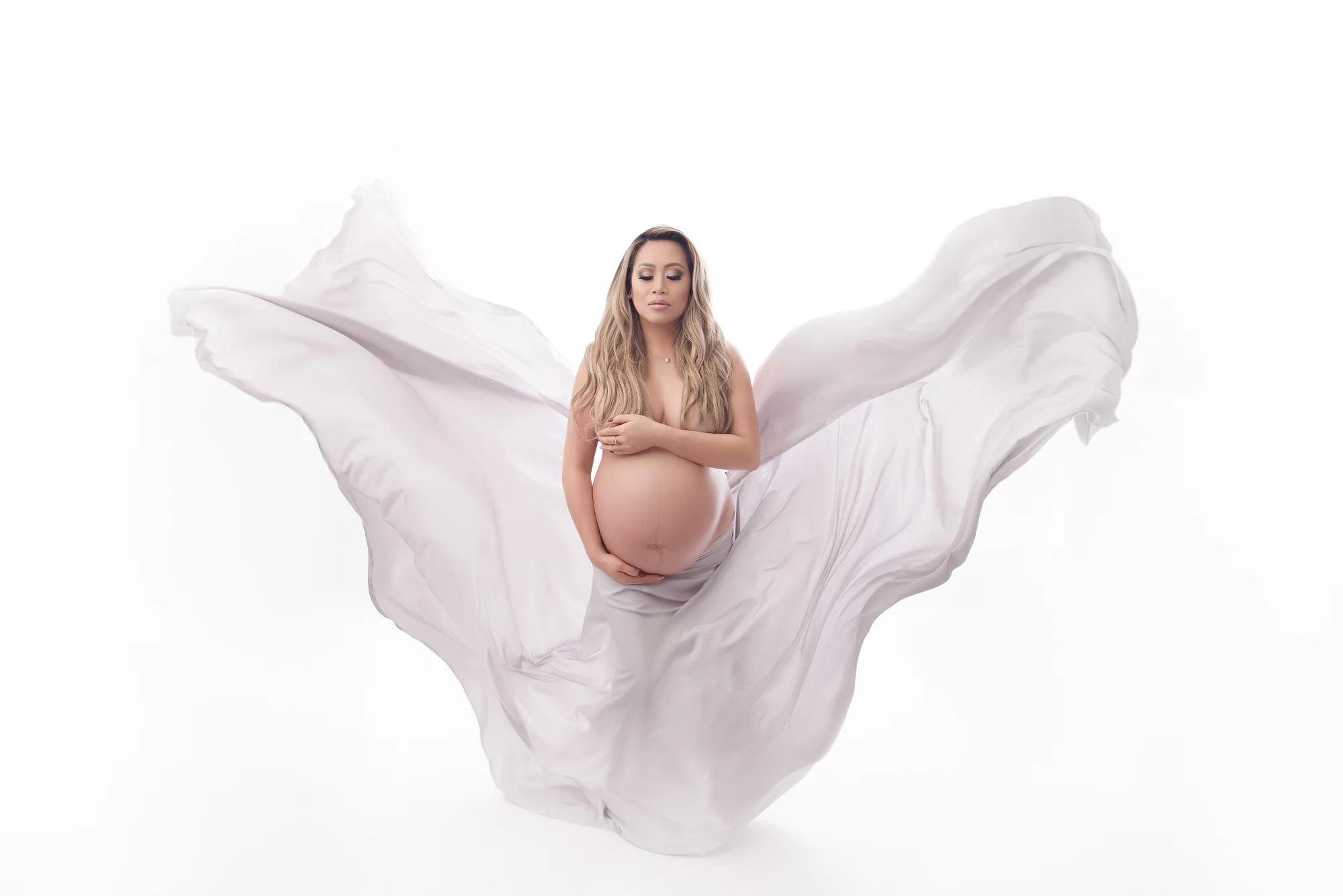 maternity photography in studio topless white gown