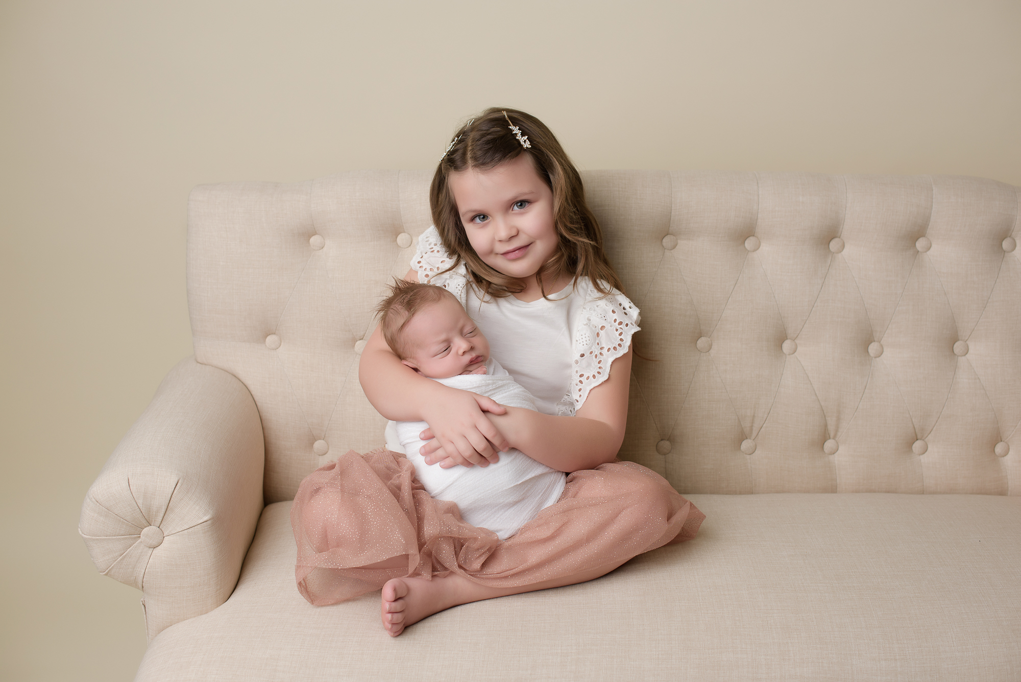 newborn photography amanda dams big sister holding little brother in her arms