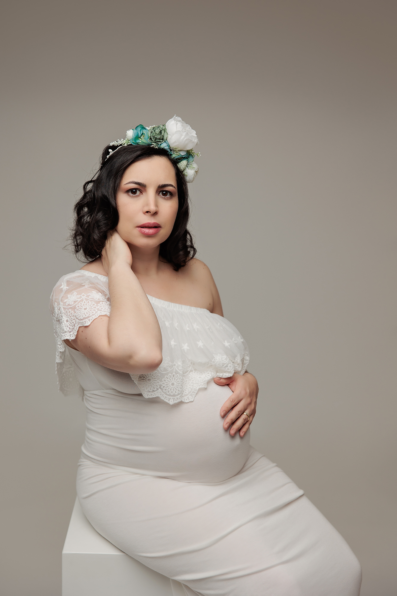 Pregnant woman wearing a flower crown during a maternity photo session in Calgary