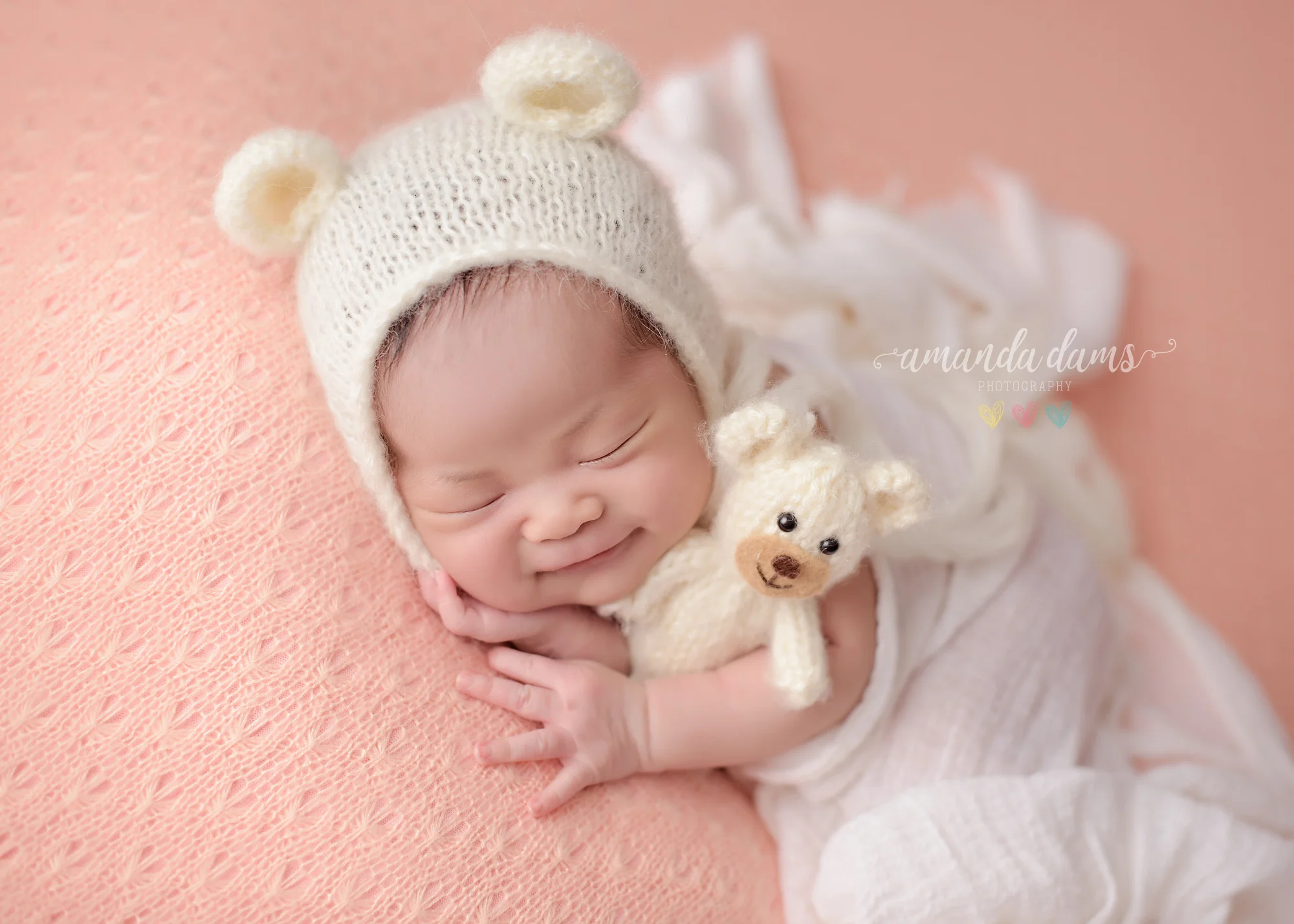Newborn Photography Calgary Newborn Smiling With Teddy Bear
