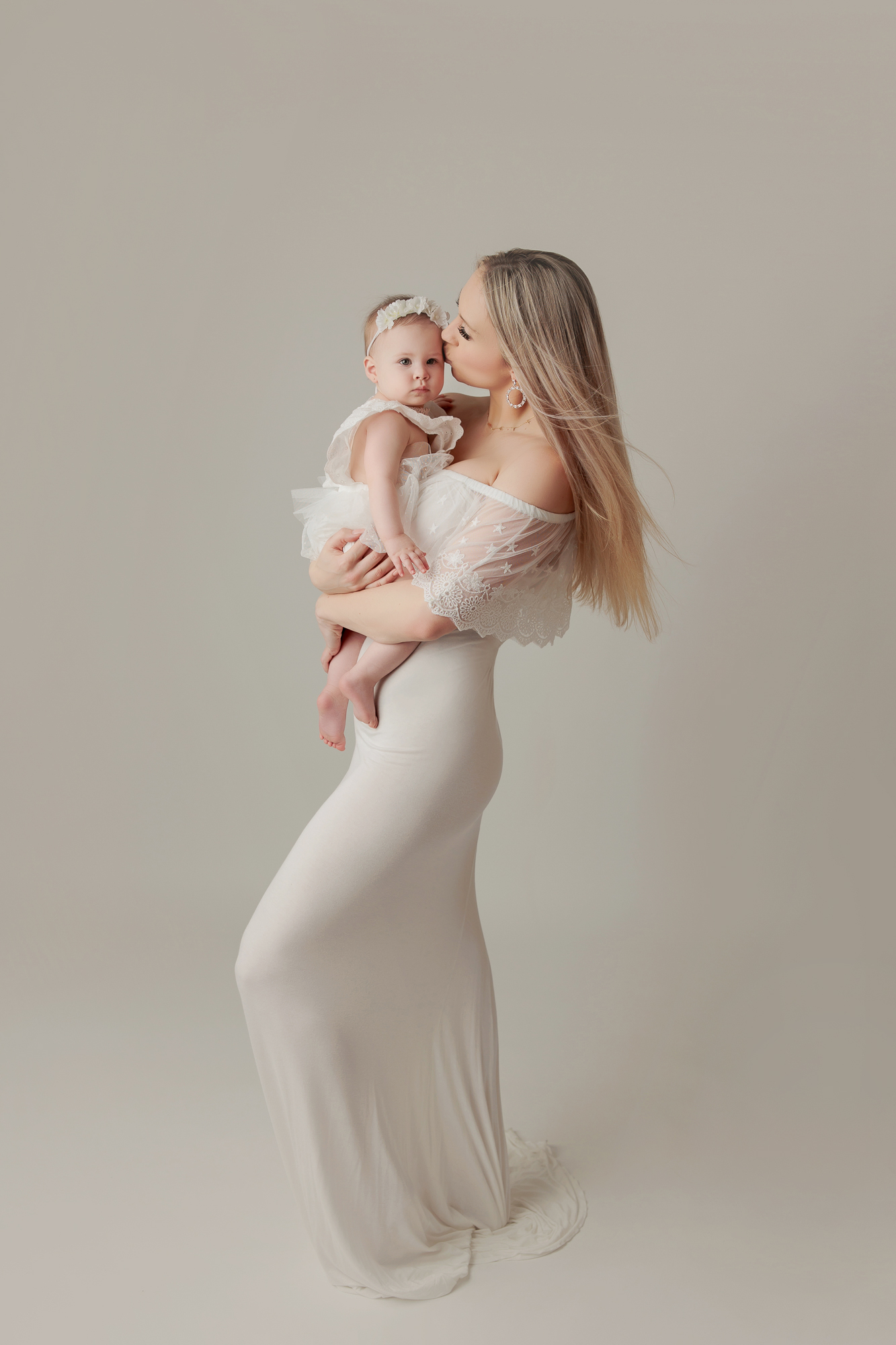 Calgary Baby Photography Mama Holding And Kissing Baby