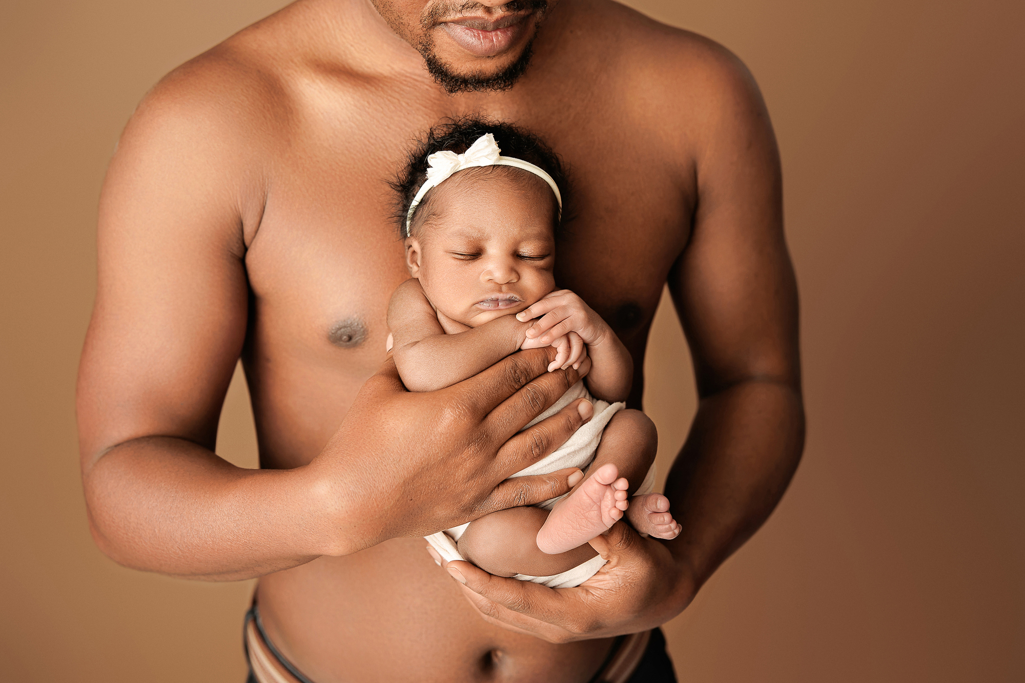 Before and after comparison style setup showing retouched newborn skin in soft studio light