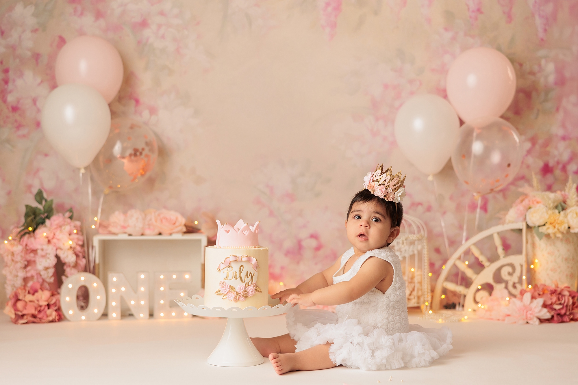 pink florals theme cake smash photography in Calgary