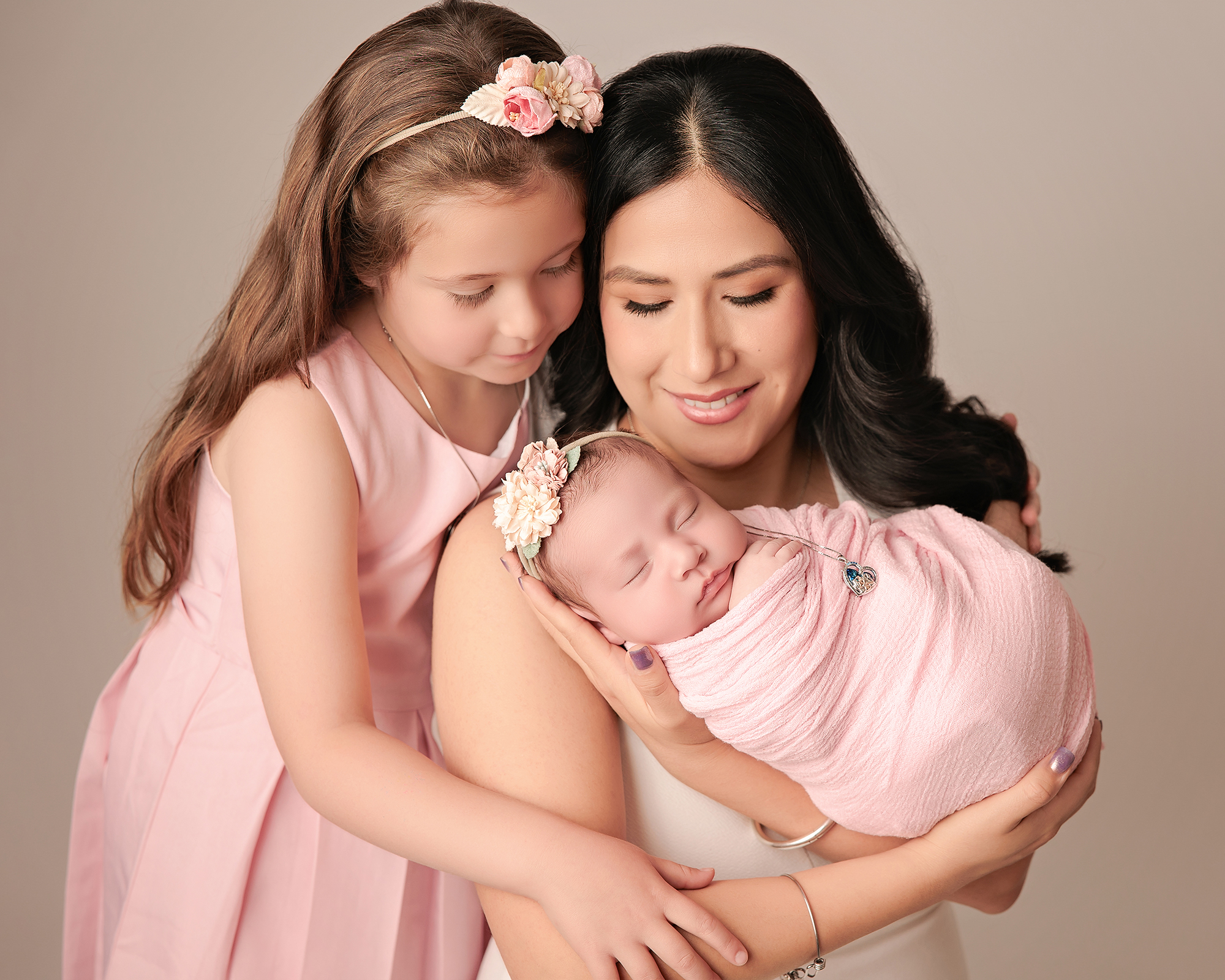 Mom and Daughter with a new baby in Calgary